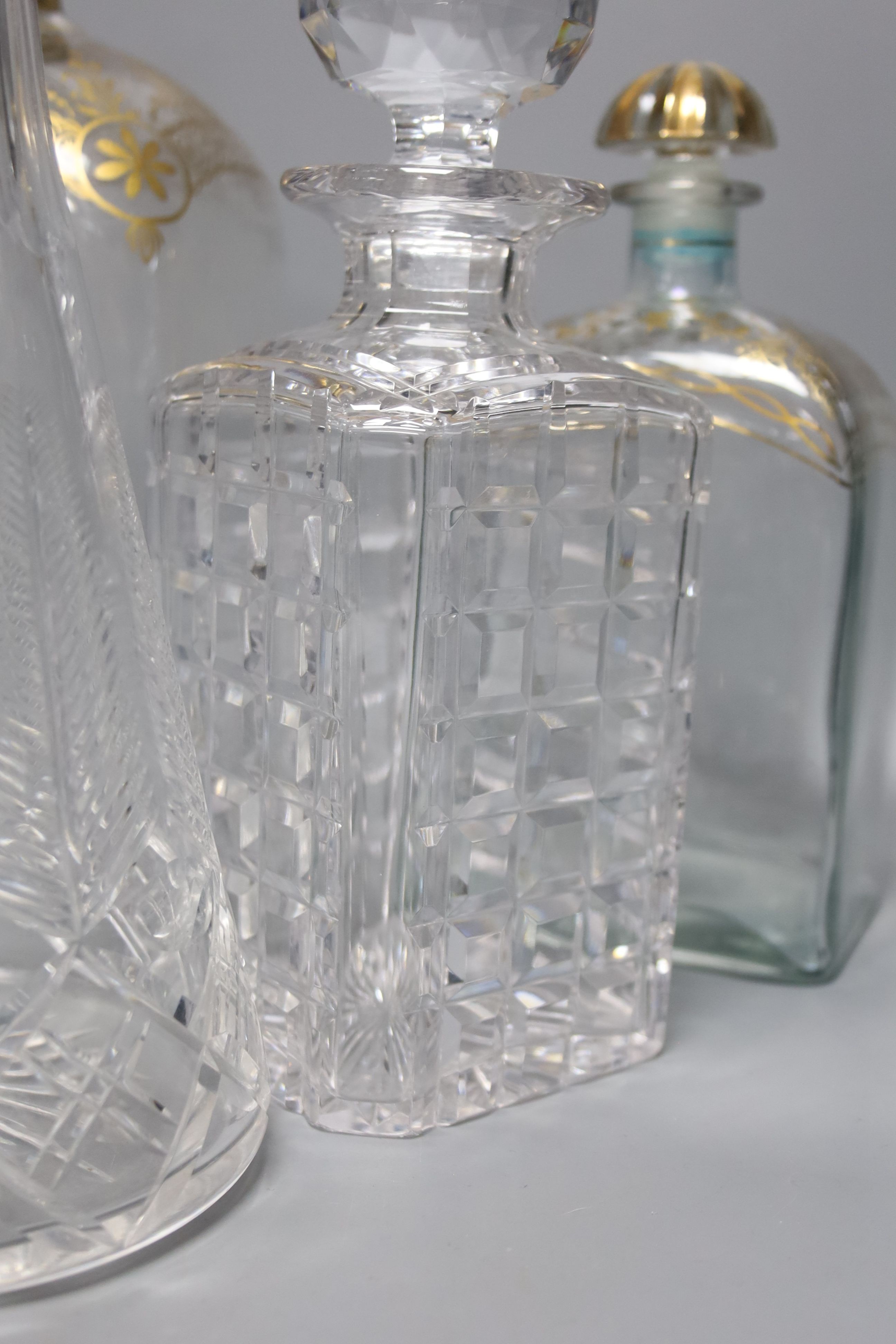 A Regency style decanter with lozenge-shaped stopper, a pair of gilt-decorated Spanish 'Jerez' decanters, a similar larger decanter and five other decanters